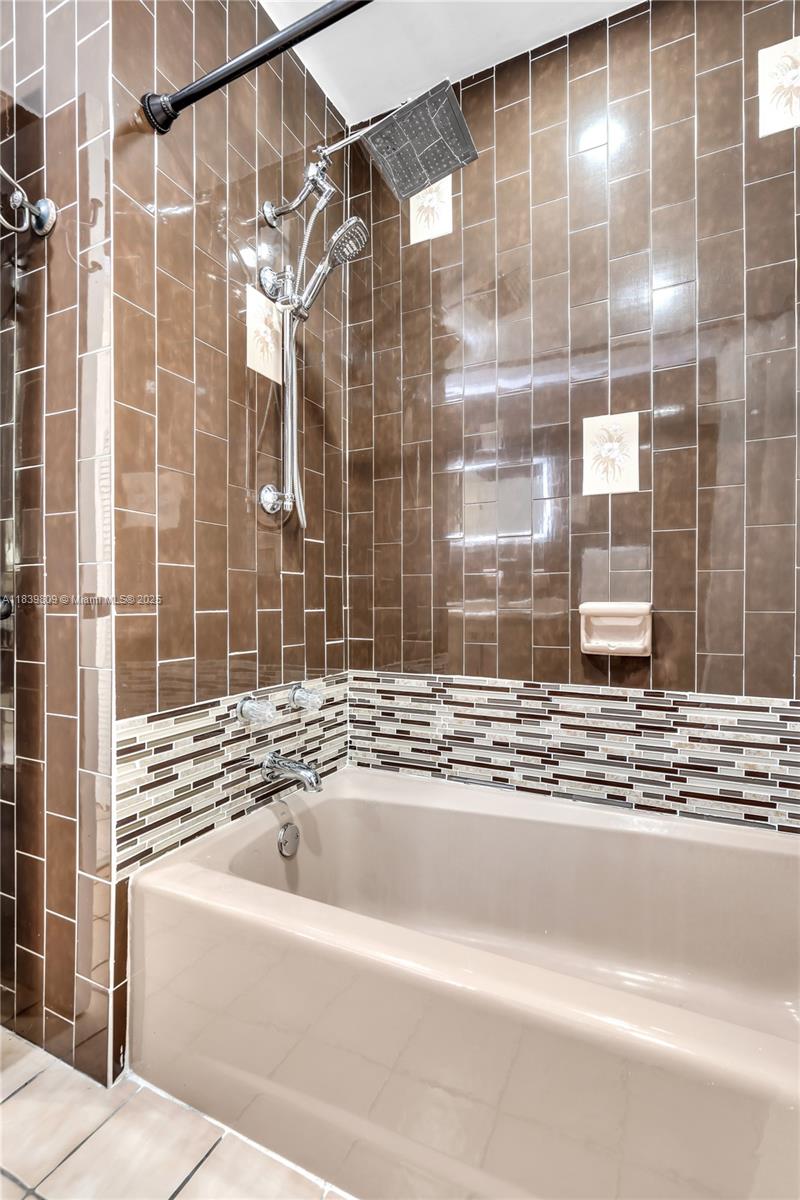 2121 Southwest 13th Avenue Miami, FL 33145 - Photo 22 of 43 a bathroom with a bathtub and shower