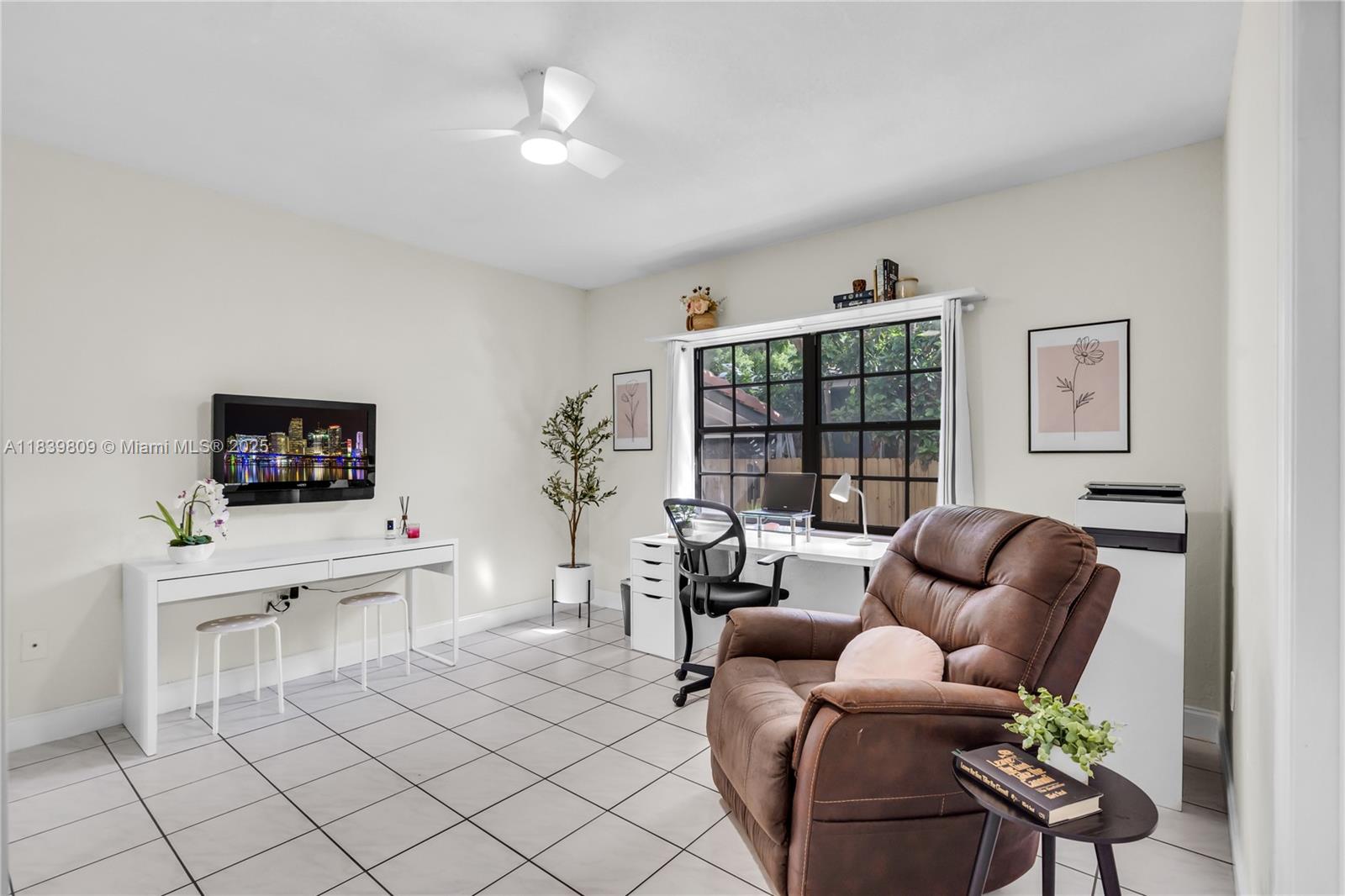 2121 Southwest 13th Avenue Miami, FL 33145 - Photo 23 of 43 a living room with furniture a fireplace and a flat screen tv