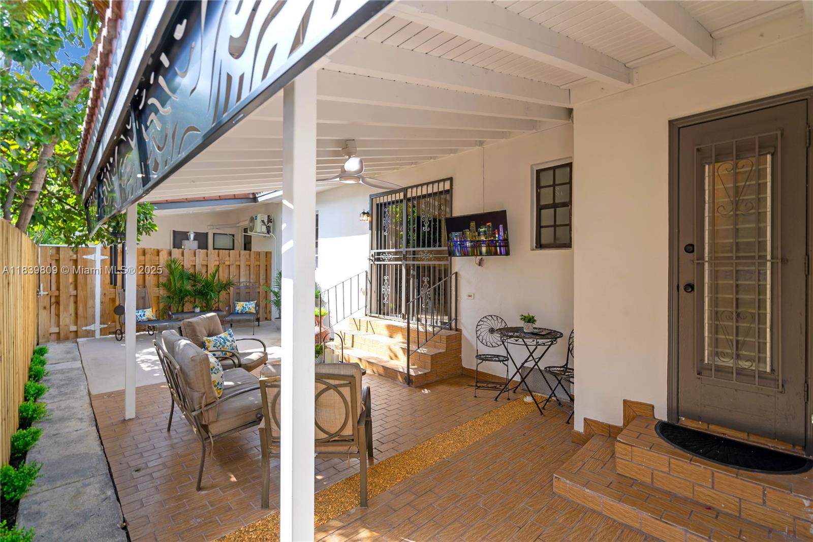 2121 Southwest 13th Avenue Miami, FL 33145 - Photo 26 of 43 a view of a patio with table and chairs and potted plants