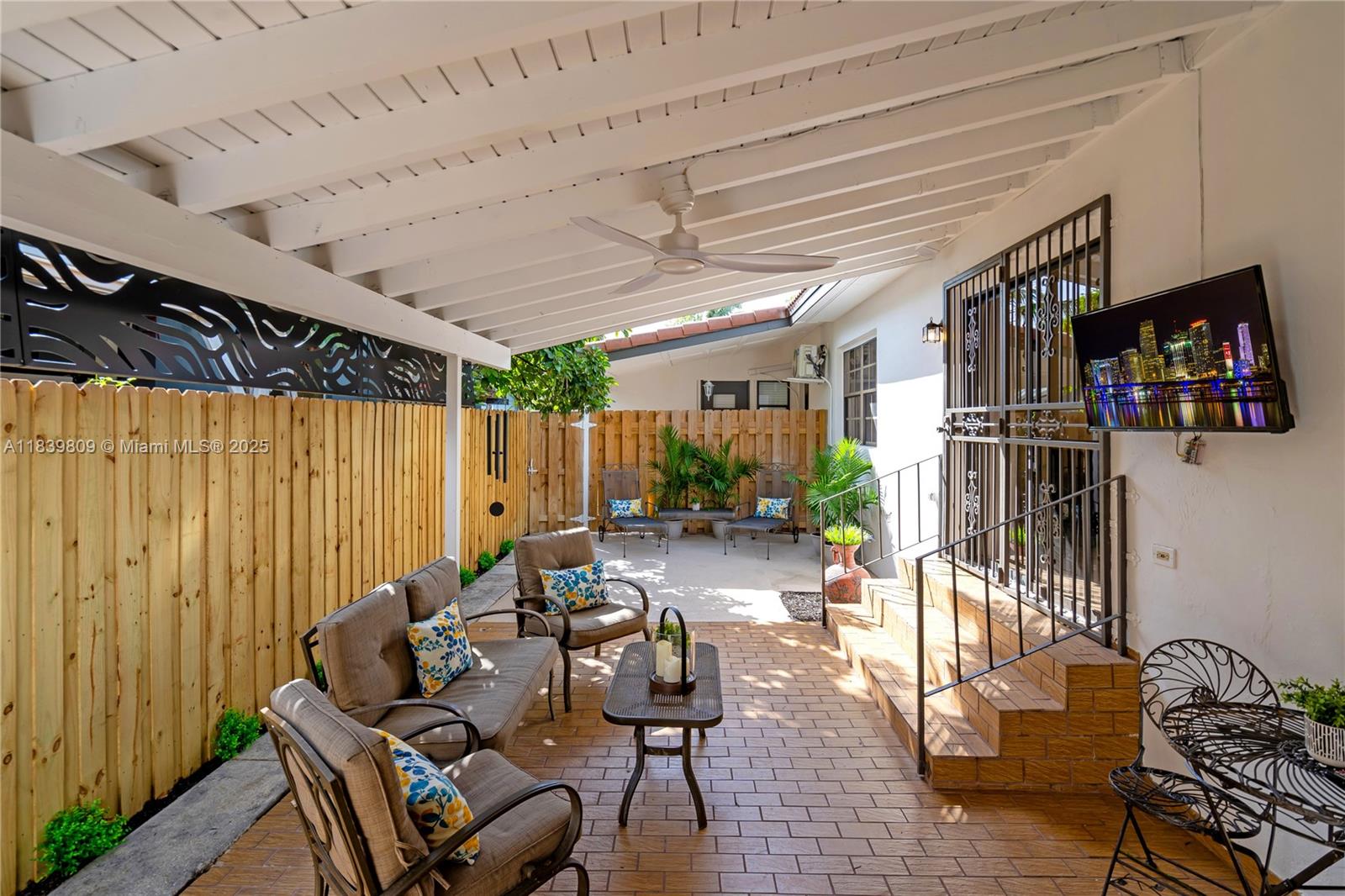 2121 Southwest 13th Avenue Miami, FL 33145 - Photo 27 of 43 a backyard of a house with seating space