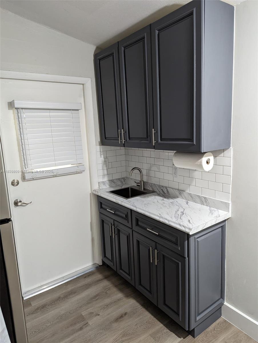 2121 Southwest 13th Avenue Miami, FL 33145 - Photo 39 of 43 a kitchen with stainless steel appliances granite countertop a sink stove and cabinets
