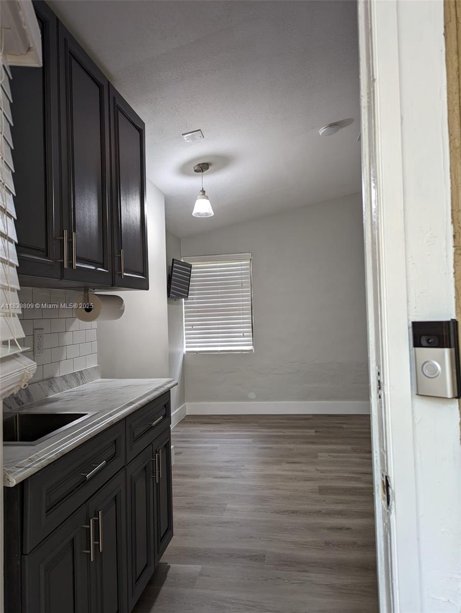 2121 Southwest 13th Avenue Miami, FL 33145 - Photo 40 of 43 a kitchen with a sink and cabinets