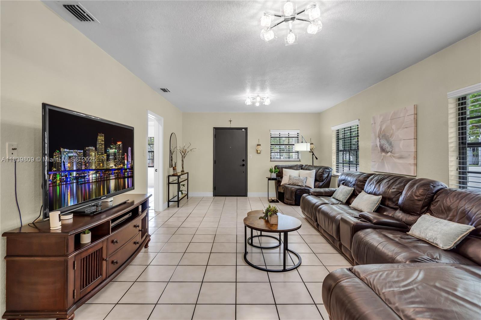 2121 Southwest 13th Avenue Miami, FL 33145 - Photo 7 of 43 a living room with furniture and a flat screen tv