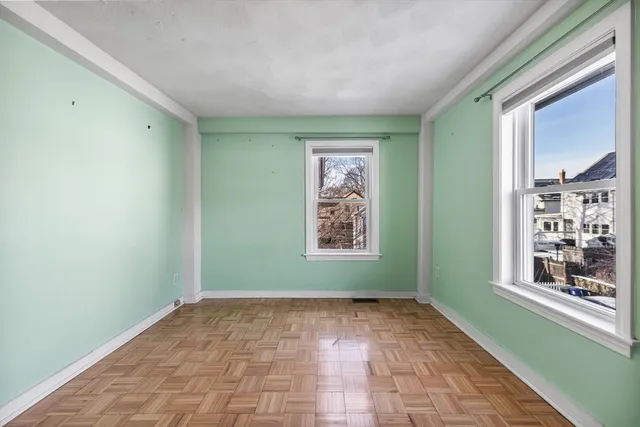 a view of an empty room with a window