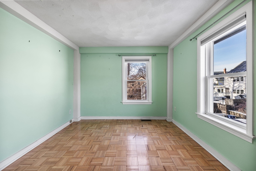 12 Wright Street, Unit 1 Stoneham, MA 02180 - Photo 16 of 36 a view of an empty room with a window