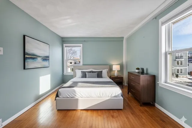 a bedroom with a large bed and a window