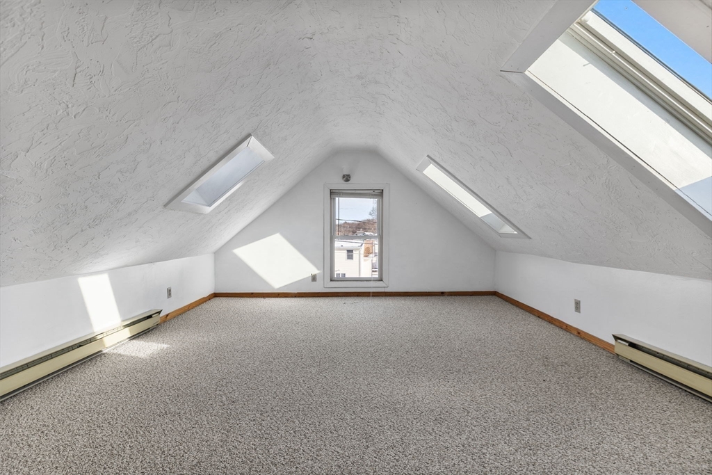 12 Wright Street, Unit 1 Stoneham, MA 02180 - Photo 24 of 36 a view of a big room with windows