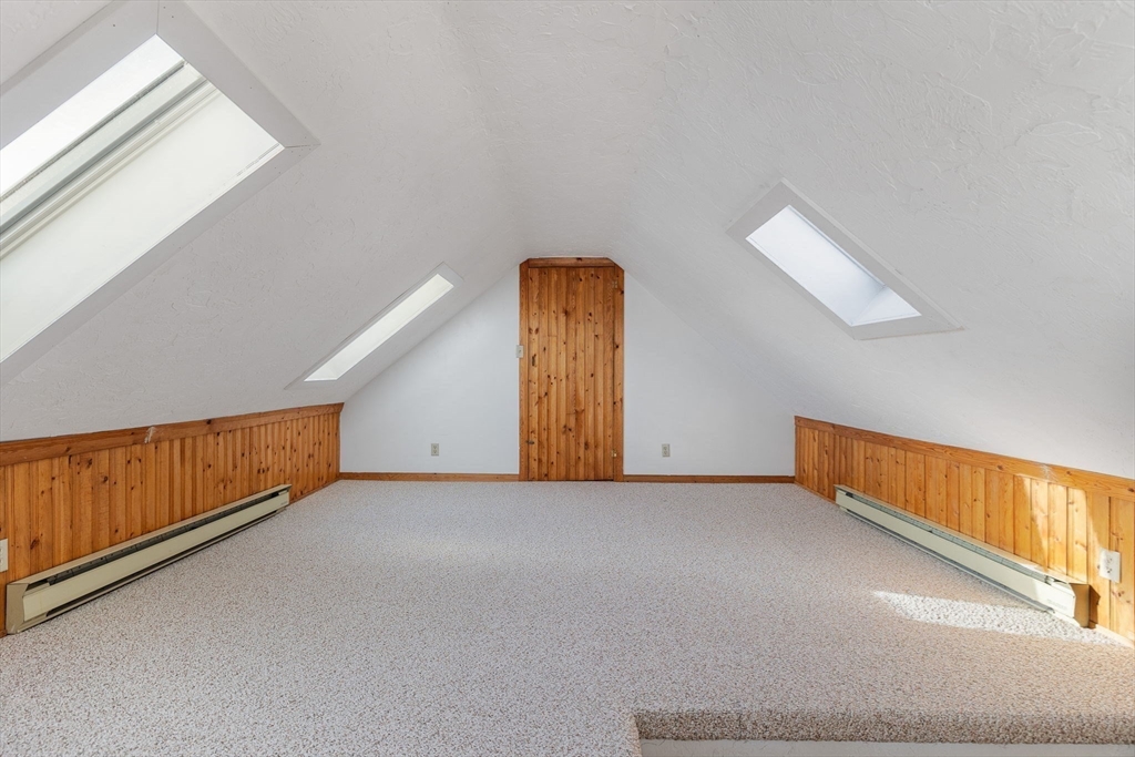 12 Wright Street, Unit 1 Stoneham, MA 02180 - Photo 26 of 36 an empty room with windows
