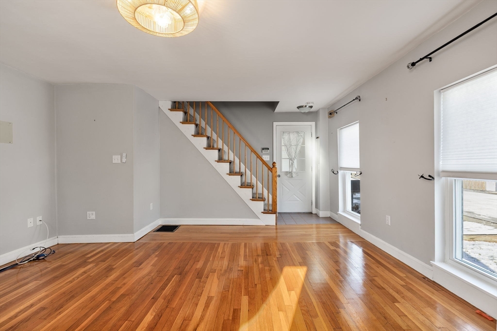 12 Wright Street, Unit 1 Stoneham, MA 02180 - Photo 4 of 36 a view of empty room with wooden floor