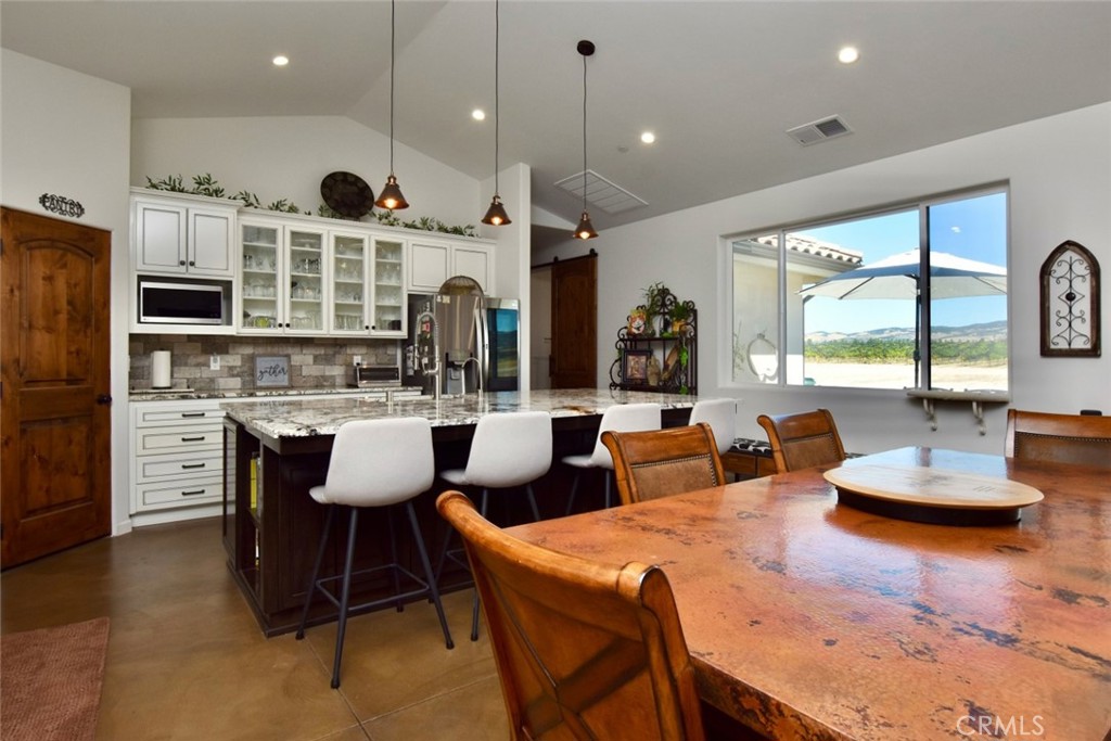 50645 Lockwood Road Lockwood, CA 93426 - Photo 20 of 48 a dinning room with furniture a large window and kitchen view