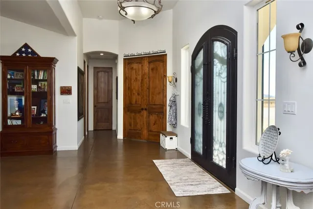 a spacious bathroom with a glass door shower and a sink