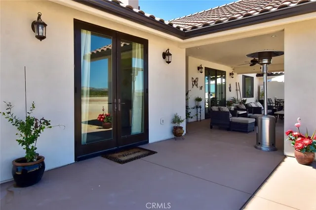 a lobby with furniture and potted plants