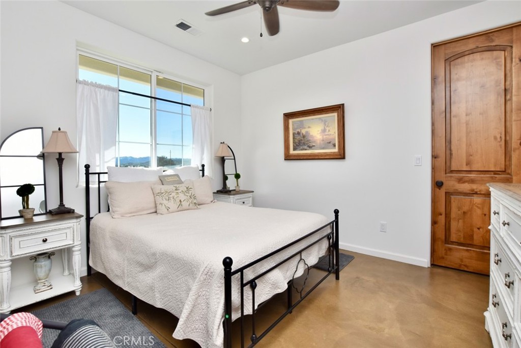 50645 Lockwood Road Lockwood, CA 93426 - Photo 29 of 48 a bedroom with a bed and a table