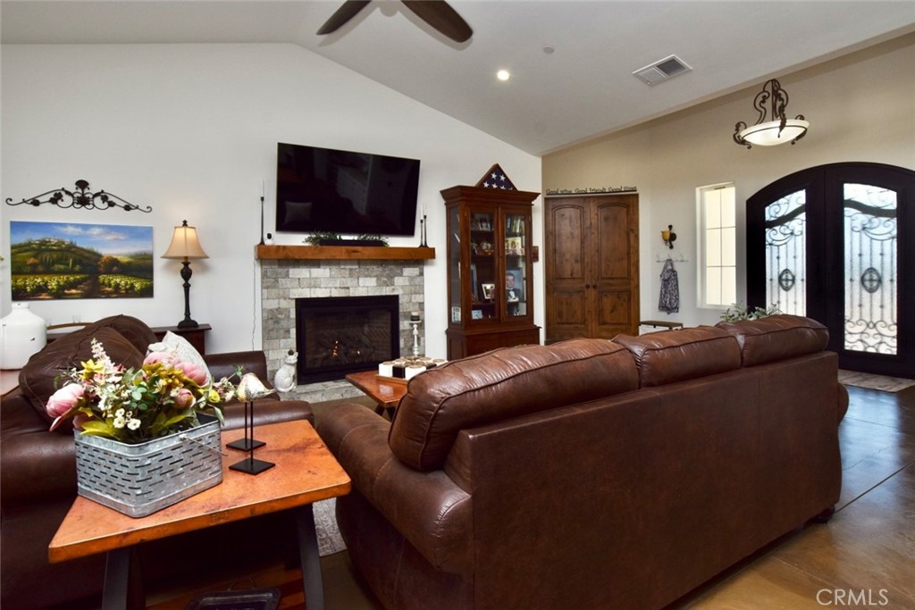 50645 Lockwood Road Lockwood, CA 93426 - Photo 9 of 48 a living room with furniture a flat screen tv and a fireplace