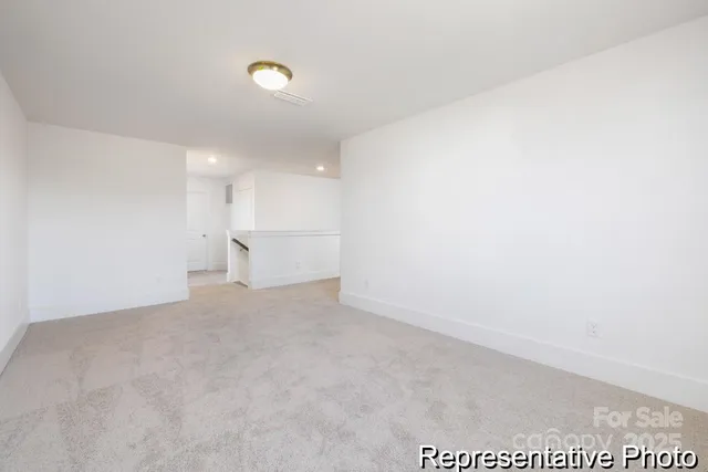 a view of a big room with windows