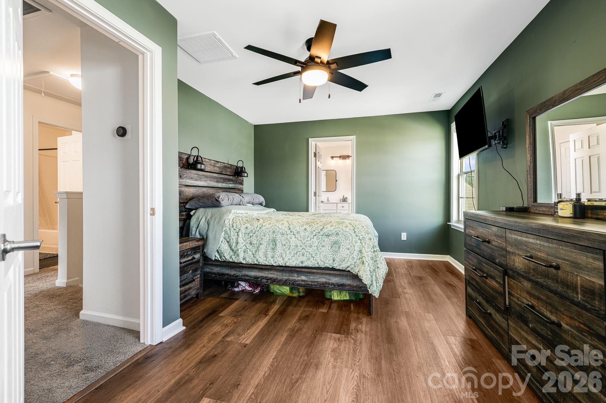 486 Cardwell Lane Fletcher, NC 28732 - Photo 15 of 35 a bedroom with a bed and wooden floor