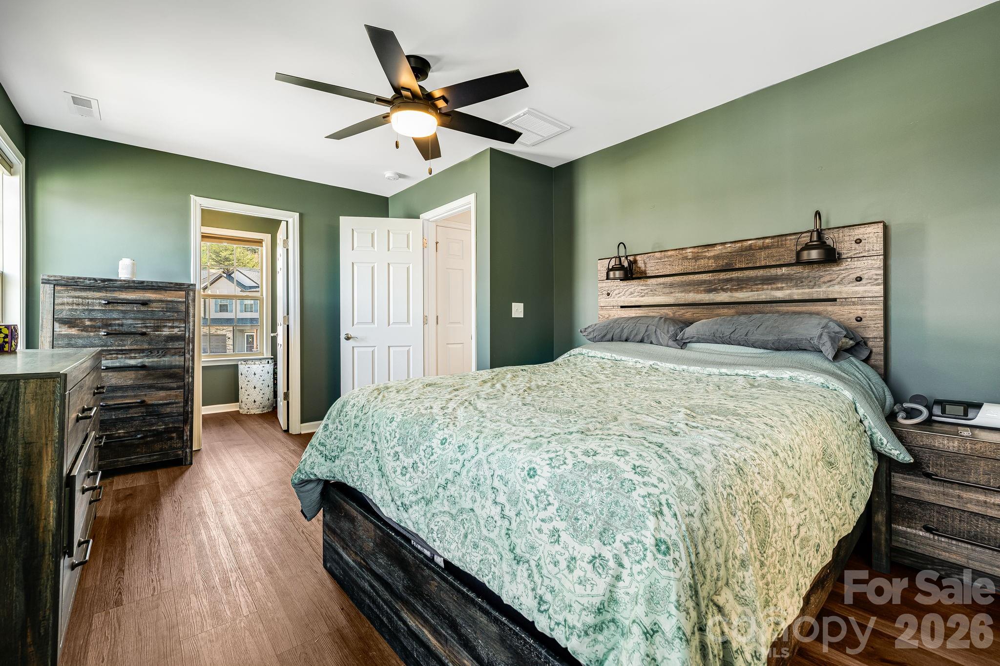 486 Cardwell Lane Fletcher, NC 28732 - Photo 17 of 35 a bedroom with a bed and wooden floor