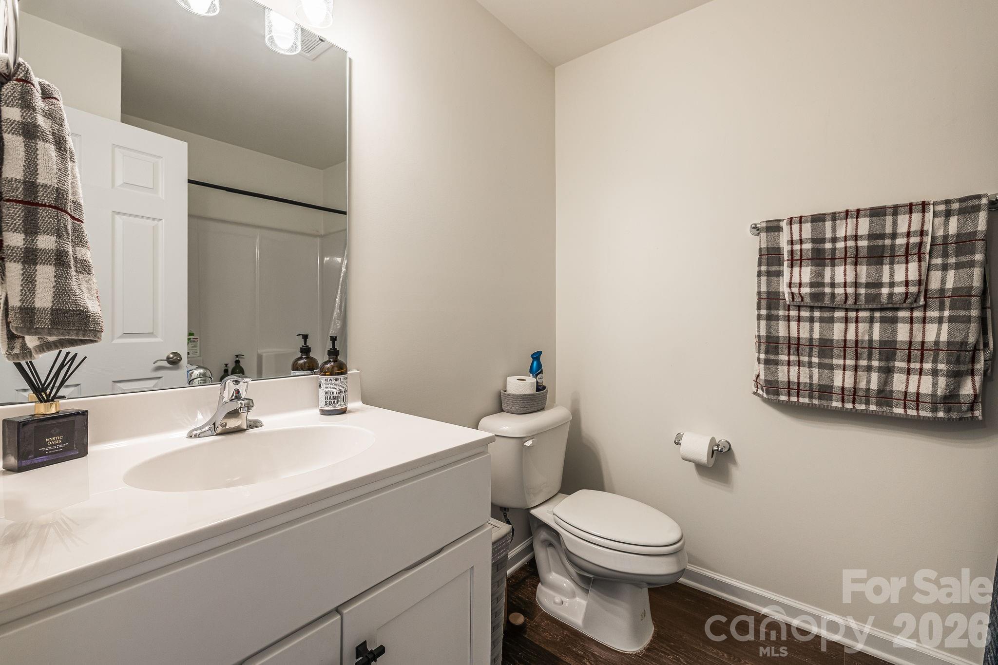 486 Cardwell Lane Fletcher, NC 28732 - Photo 21 of 35 a bathroom with a sink a toilet and mirror