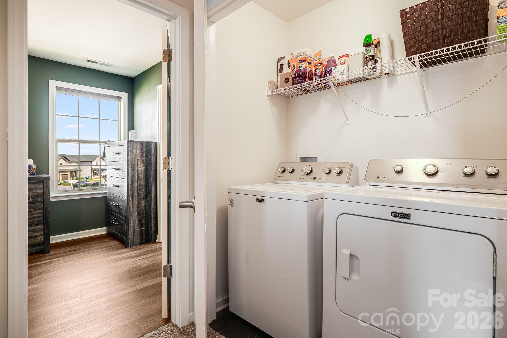 486 Cardwell Lane Fletcher, NC 28732 - Photo 24 of 35 a utility room with cabinets washer and dryer