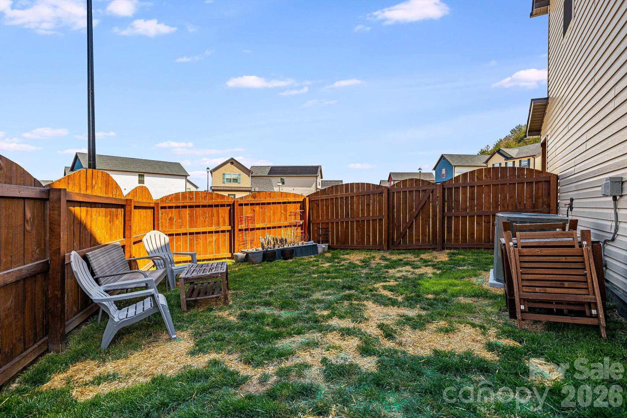 486 Cardwell Lane Fletcher, NC 28732 - Photo 27 of 35 a view of a chairs and table in the backyard