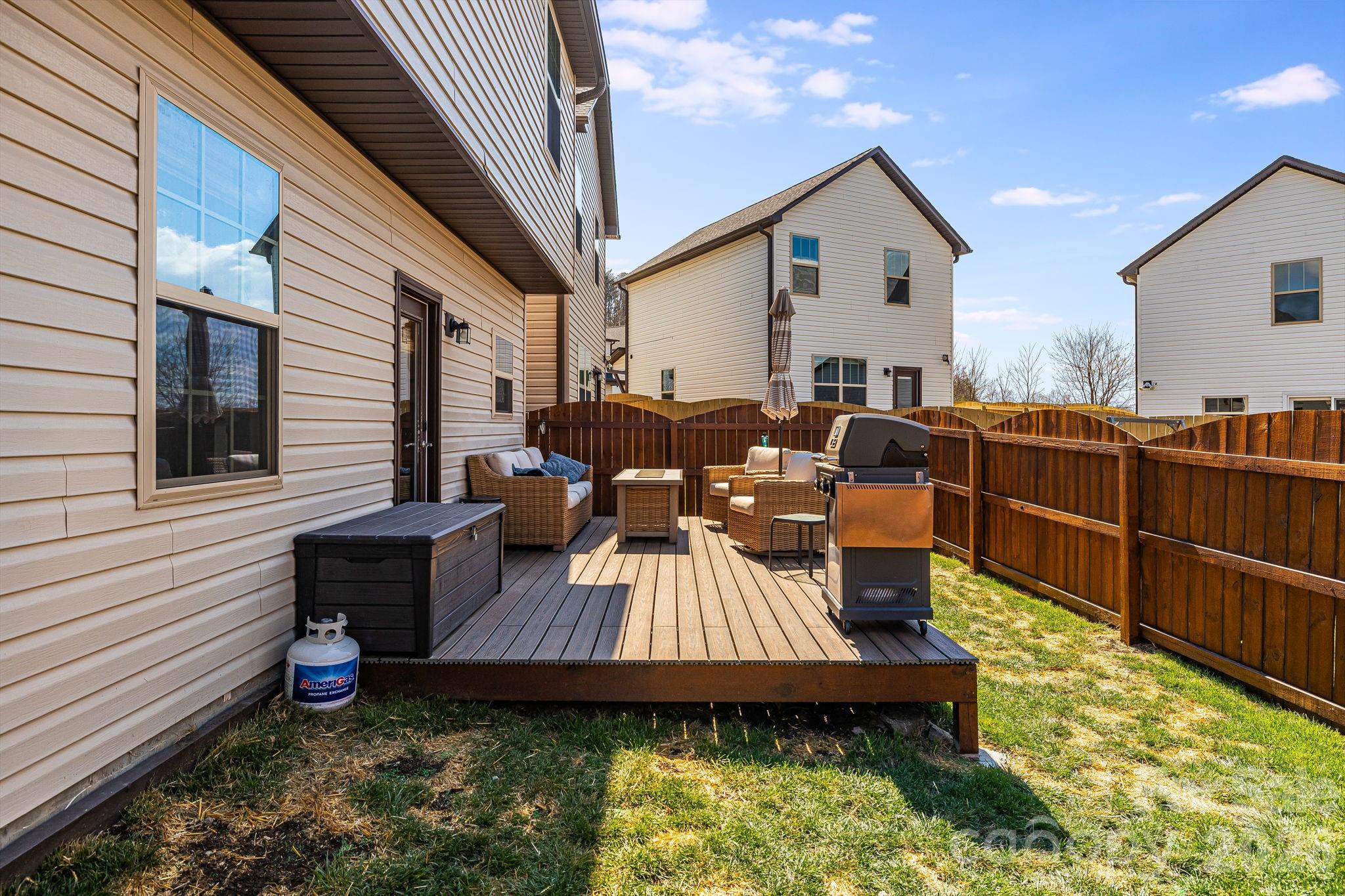 486 Cardwell Lane Fletcher, NC 28732 - Photo 28 of 35 a view of a patio with table and chairs with wooden floor and fence