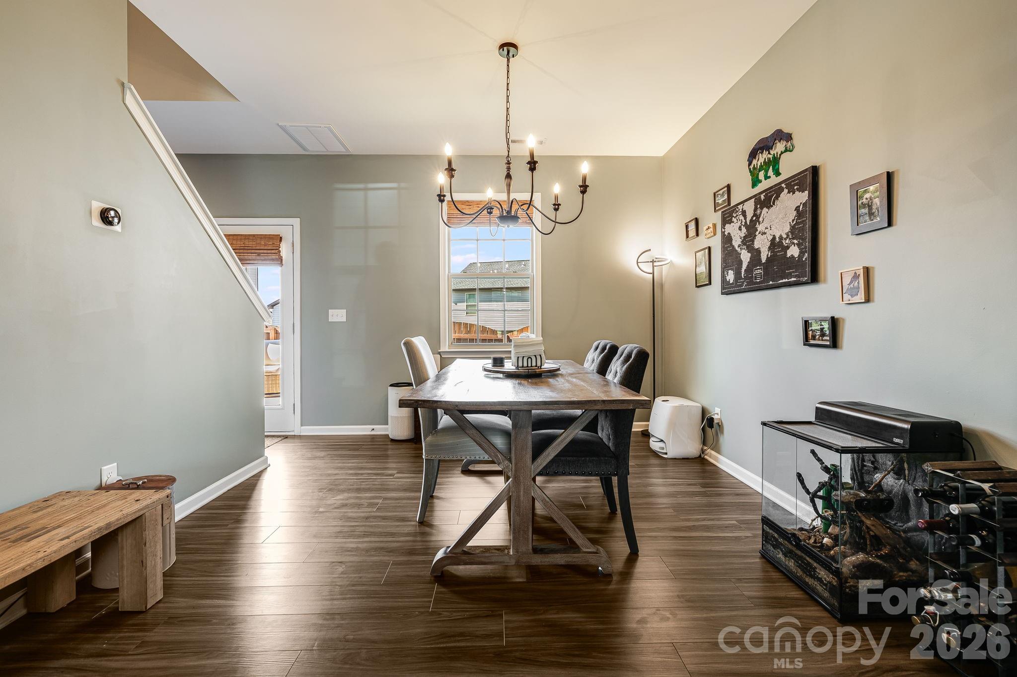 486 Cardwell Lane Fletcher, NC 28732 - Photo 3 of 35 a view of a dining room with furniture window and wooden floor