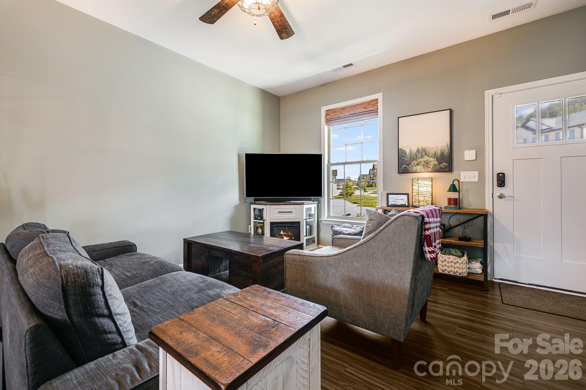 486 Cardwell Lane Fletcher, NC 28732 - Photo 6 of 35 a living room with furniture and a flat screen tv