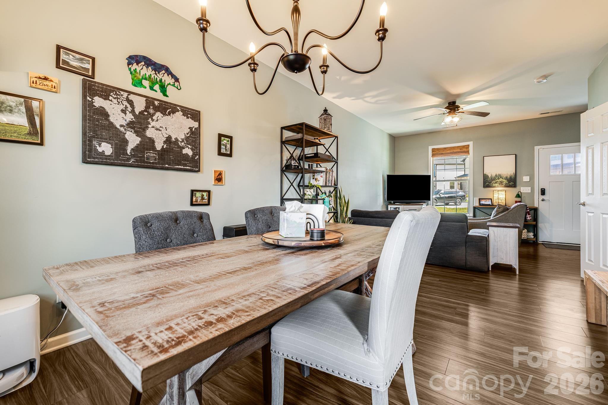 486 Cardwell Lane Fletcher, NC 28732 - Photo 9 of 35 a view of a dining room with furniture wooden floor and chandelier