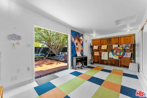 a room with furniture mirror and a rug