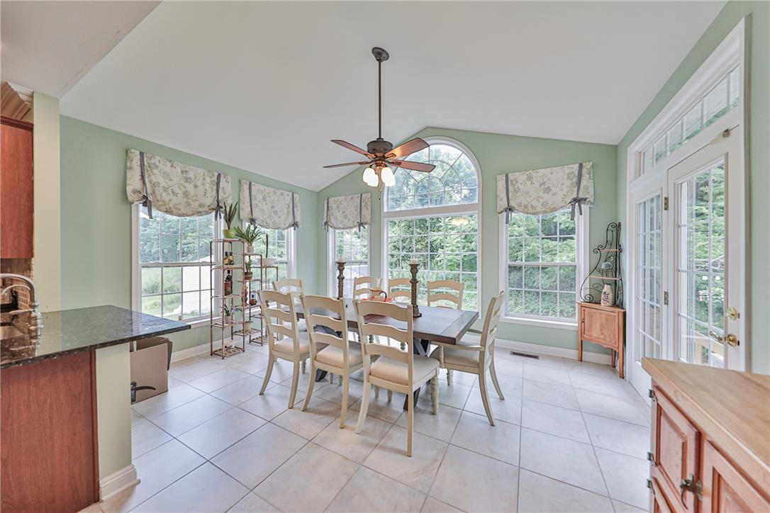 138 Clover Hollow Road Easton, PA 18045 - Photo 24 of 95 A well-lit dining area features vaulted ceilings, ample windows, and direct outdoor access.
