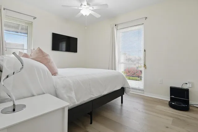 a bedroom with a bed and a television