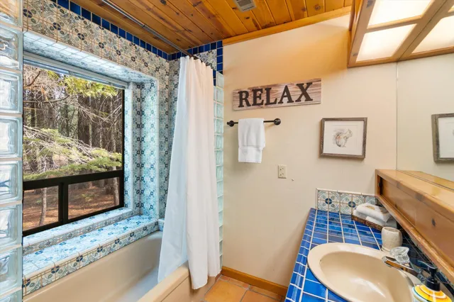 a view of a room with wooden floor and furniture