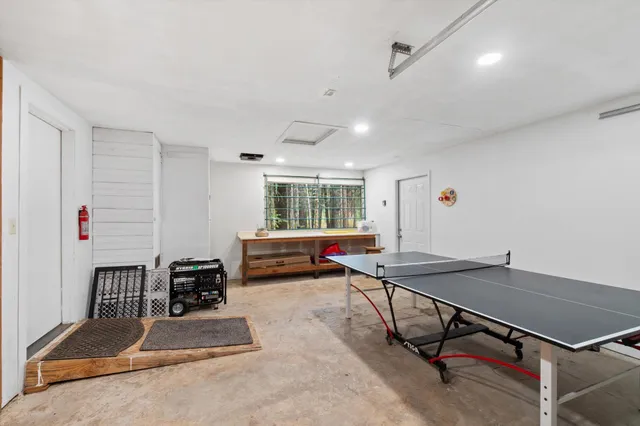 a room with gym equipment and a table