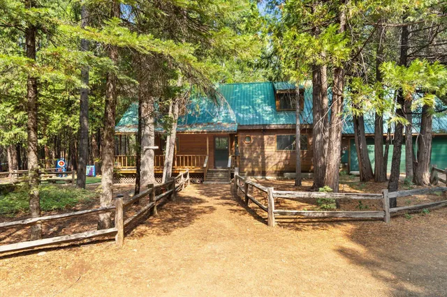 a view of road with large trees