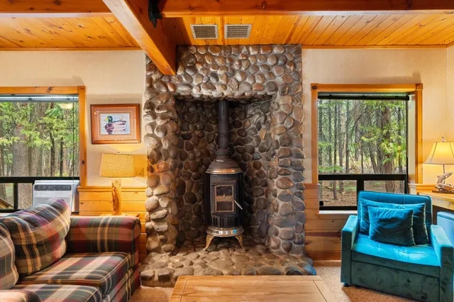 a outdoor living space with furniture and a fireplace