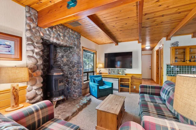 a outdoor living space with furniture and a flat screen tv