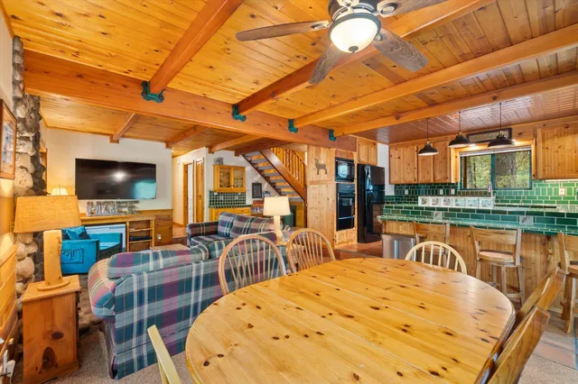 a swimming pool with outdoor seating and yard