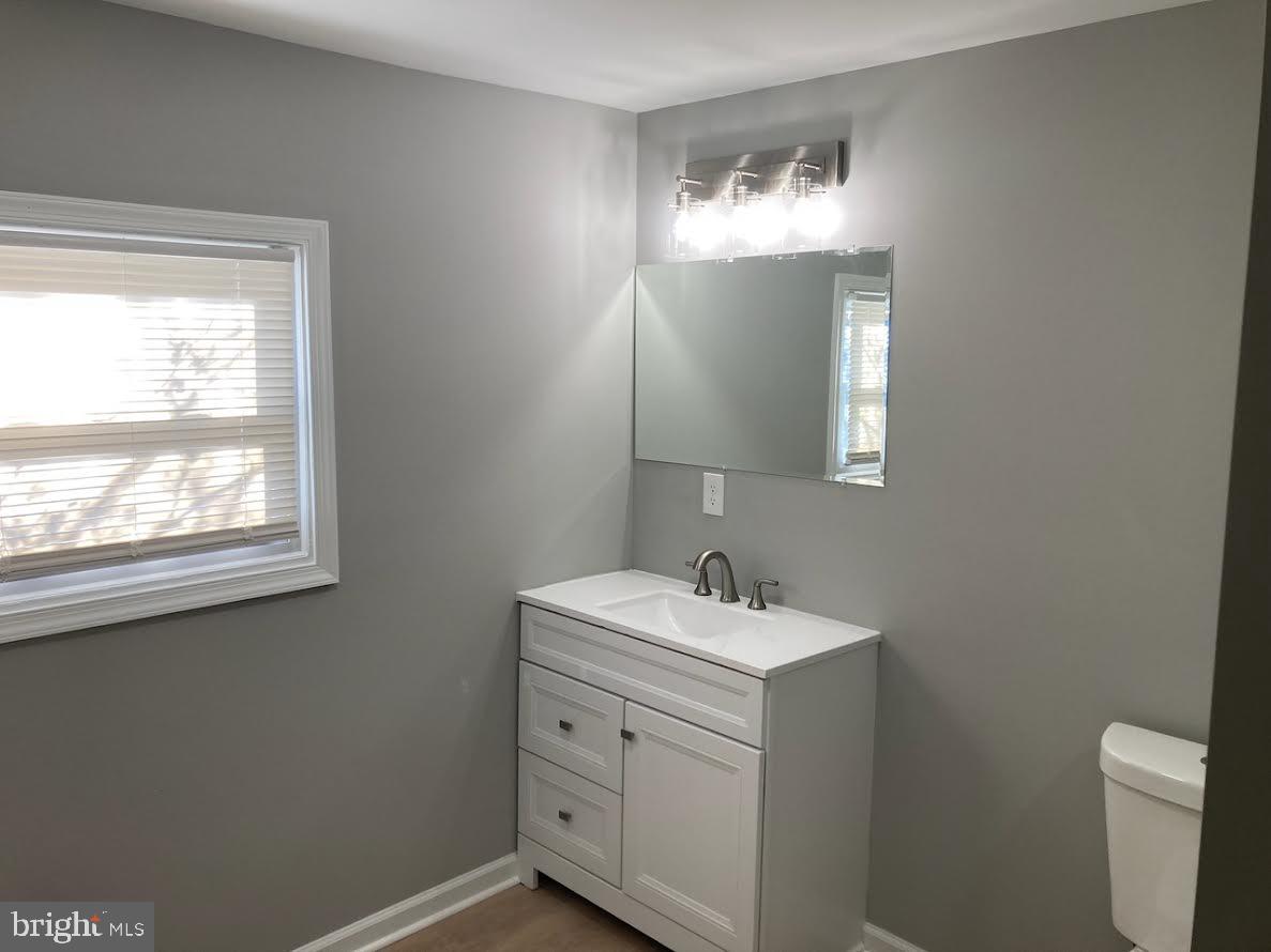72 Alden Avenue Riverside, NJ 08075 - Photo 23 of 26 a bathroom with a sink and a mirror