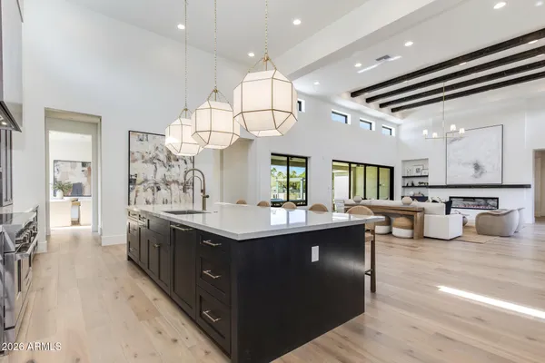 a kitchen with a dining table and chairs