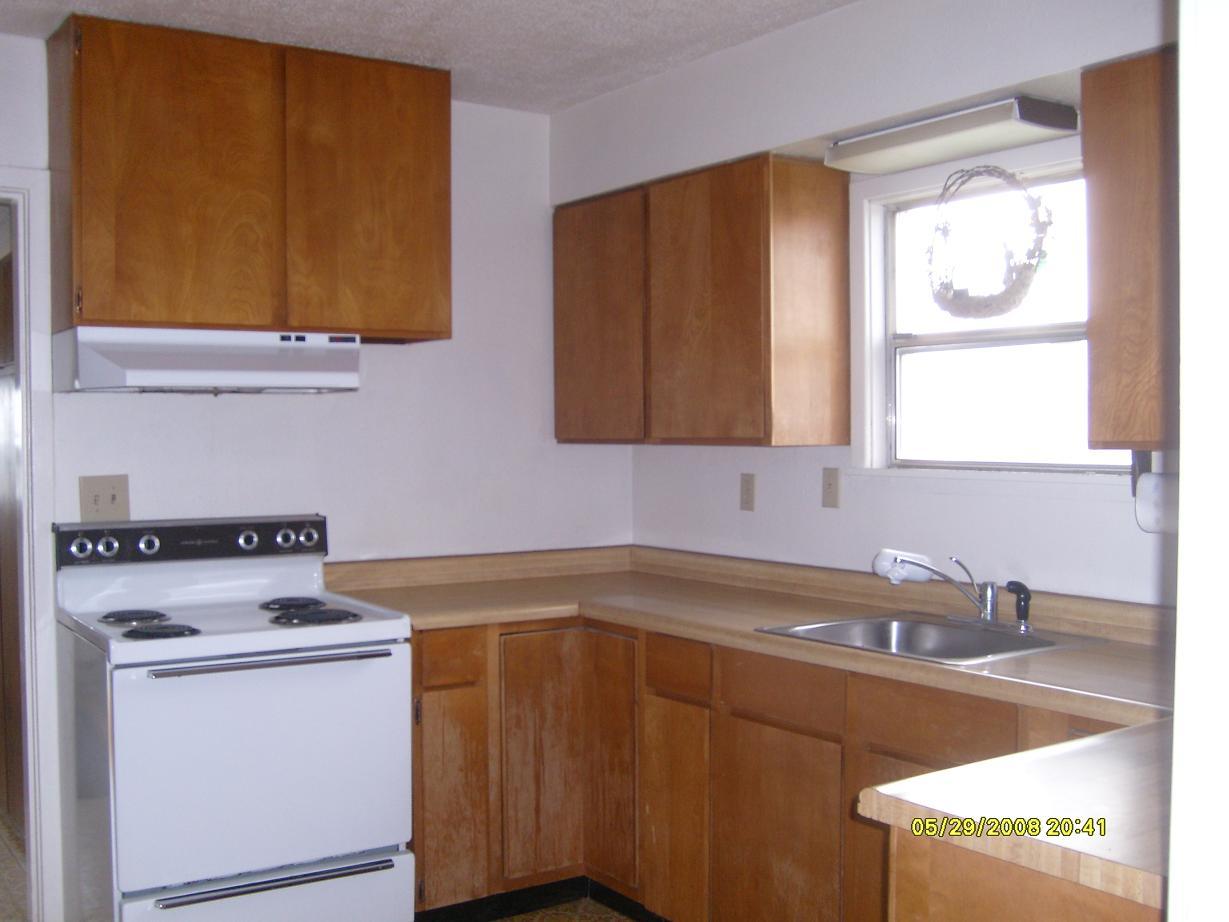 2971 Becker Road Toppenish, WA 98948 - Photo 3 of 7 a kitchen with a sink cabinets and a stove top oven