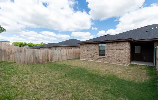 a view of a backyard with a garden