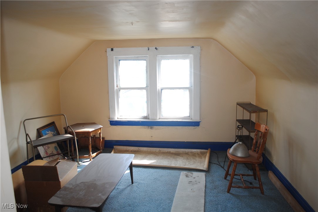 841 Whitcomb Road Cleveland, OH 44110 - Photo 28 of 30 Bonus room with lofted ceiling and carpet flooring