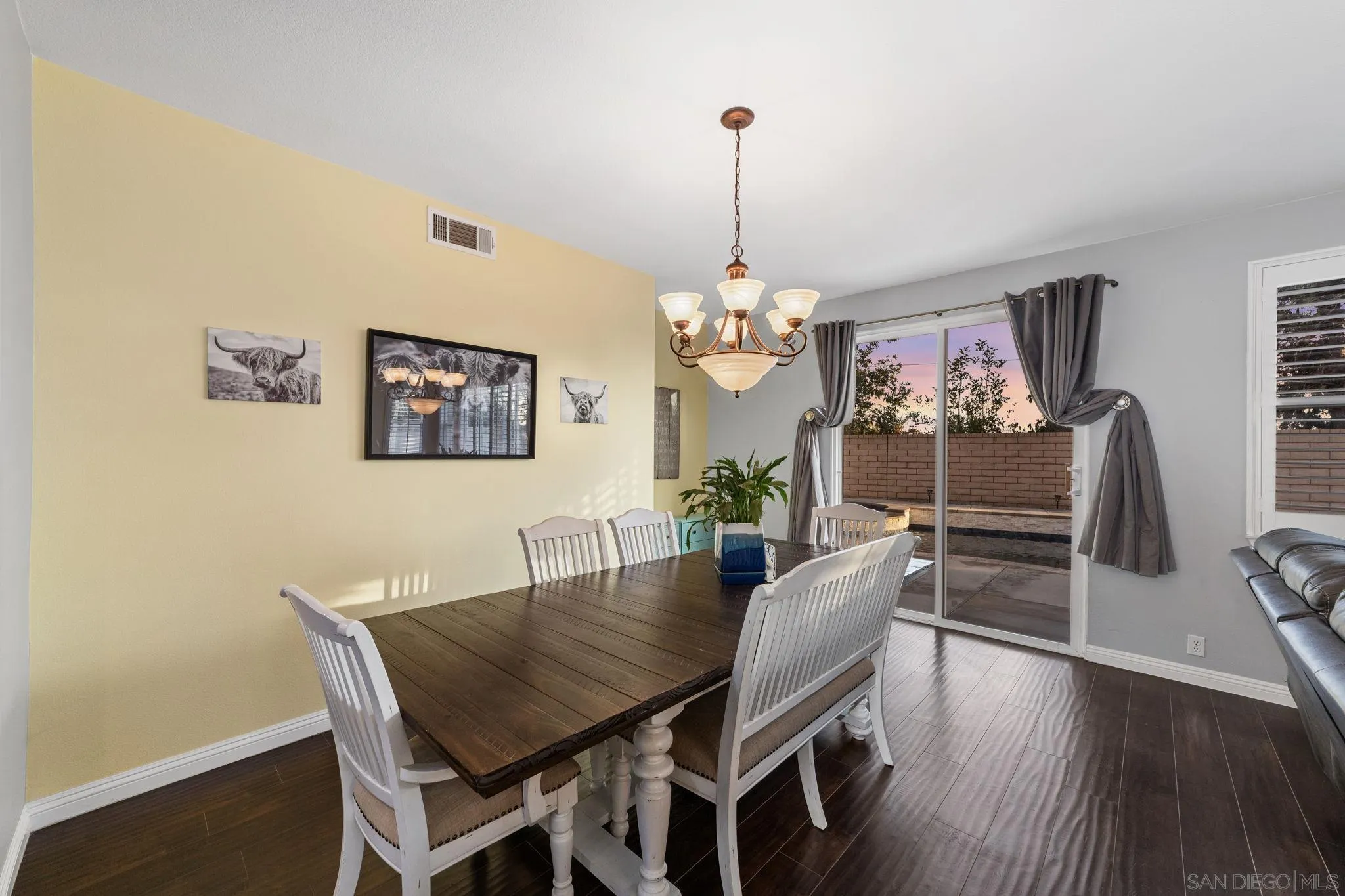 2103 Drew Road Escondido, CA 92027 - Photo 16 of 60 a view of a dining room with furniture wooden floor and chandelier