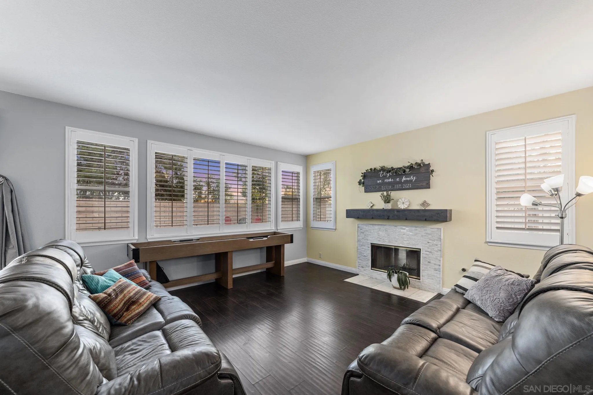 2103 Drew Road Escondido, CA 92027 - Photo 19 of 60 a living room with furniture window and a fireplace