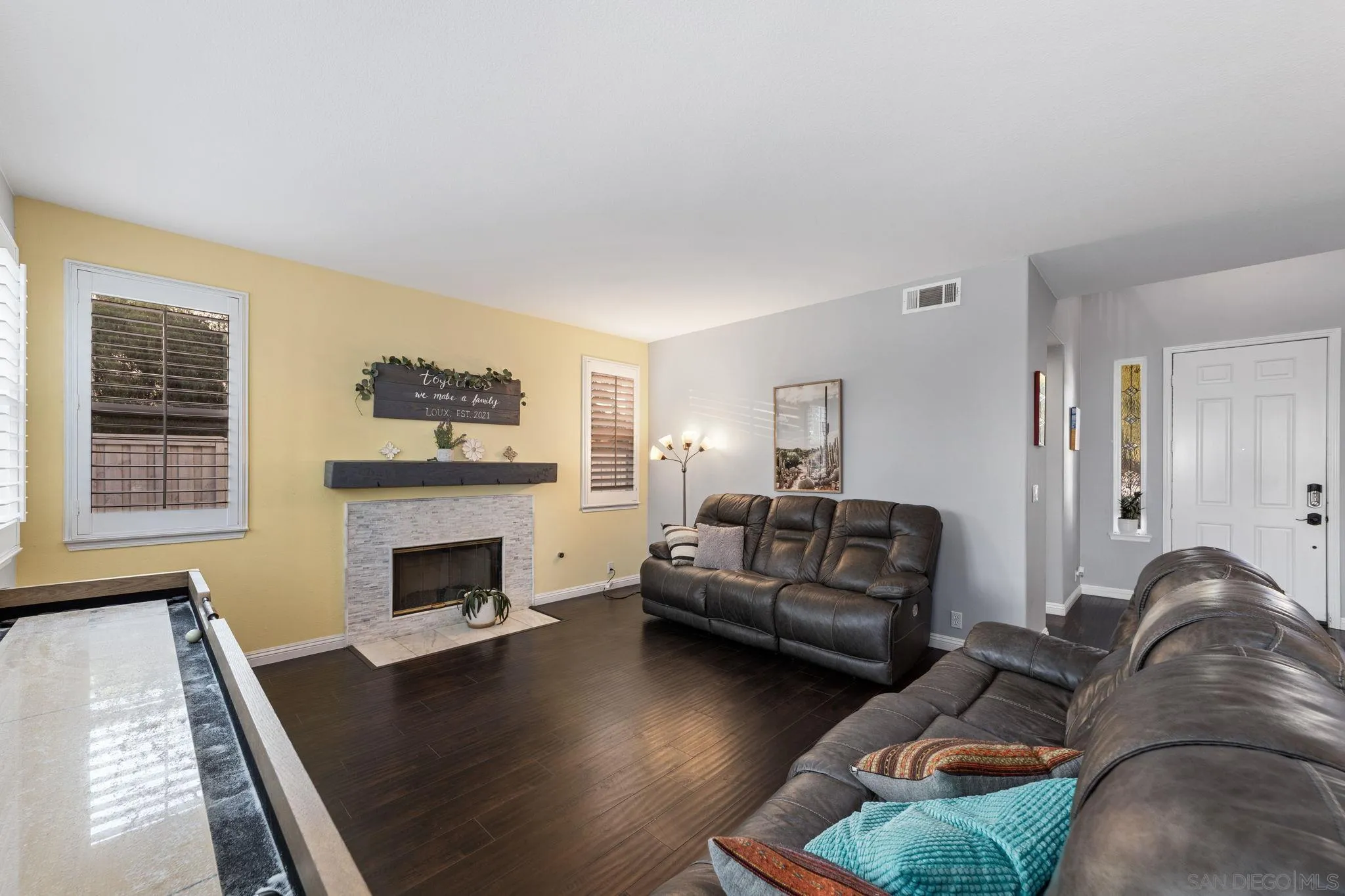2103 Drew Road Escondido, CA 92027 - Photo 20 of 60 a living room with furniture and a fireplace