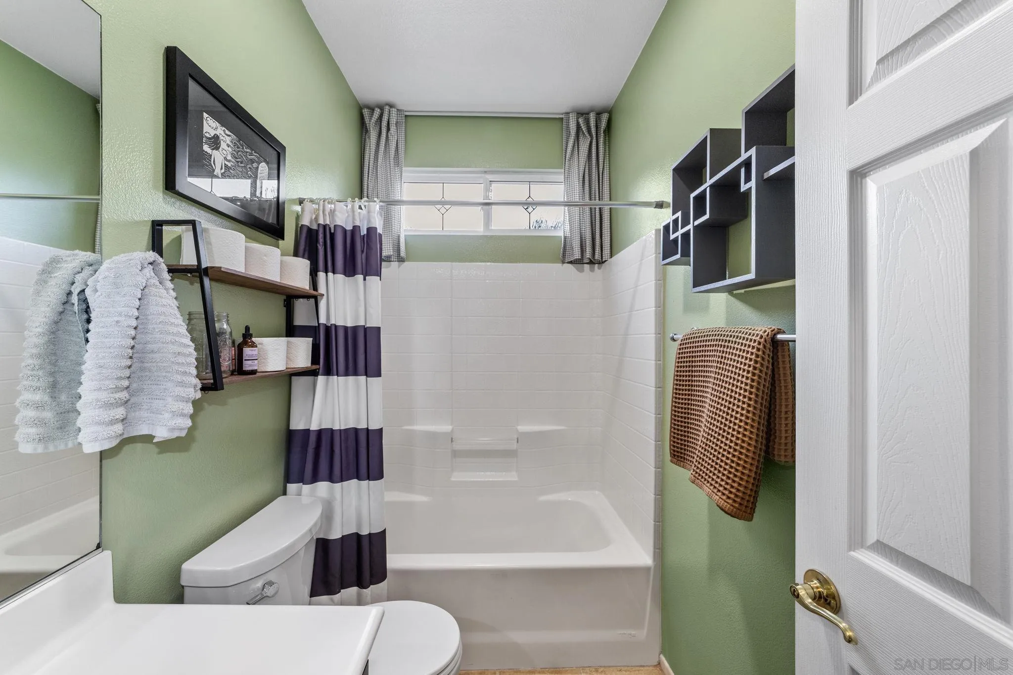 2103 Drew Road Escondido, CA 92027 - Photo 22 of 60 a bathroom with a bathtub and a shower