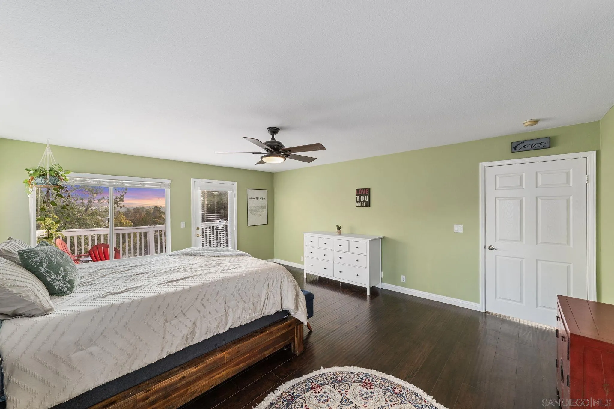 2103 Drew Road Escondido, CA 92027 - Photo 27 of 60 a bedroom with a bed and wooden floor