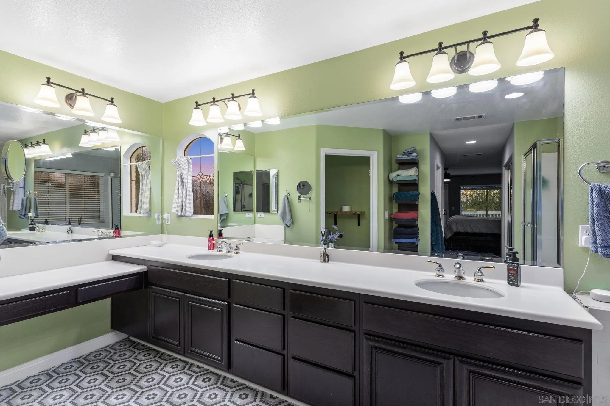 2103 Drew Road Escondido, CA 92027 - Photo 29 of 60 a bathroom with a double vanity sink and a mirror