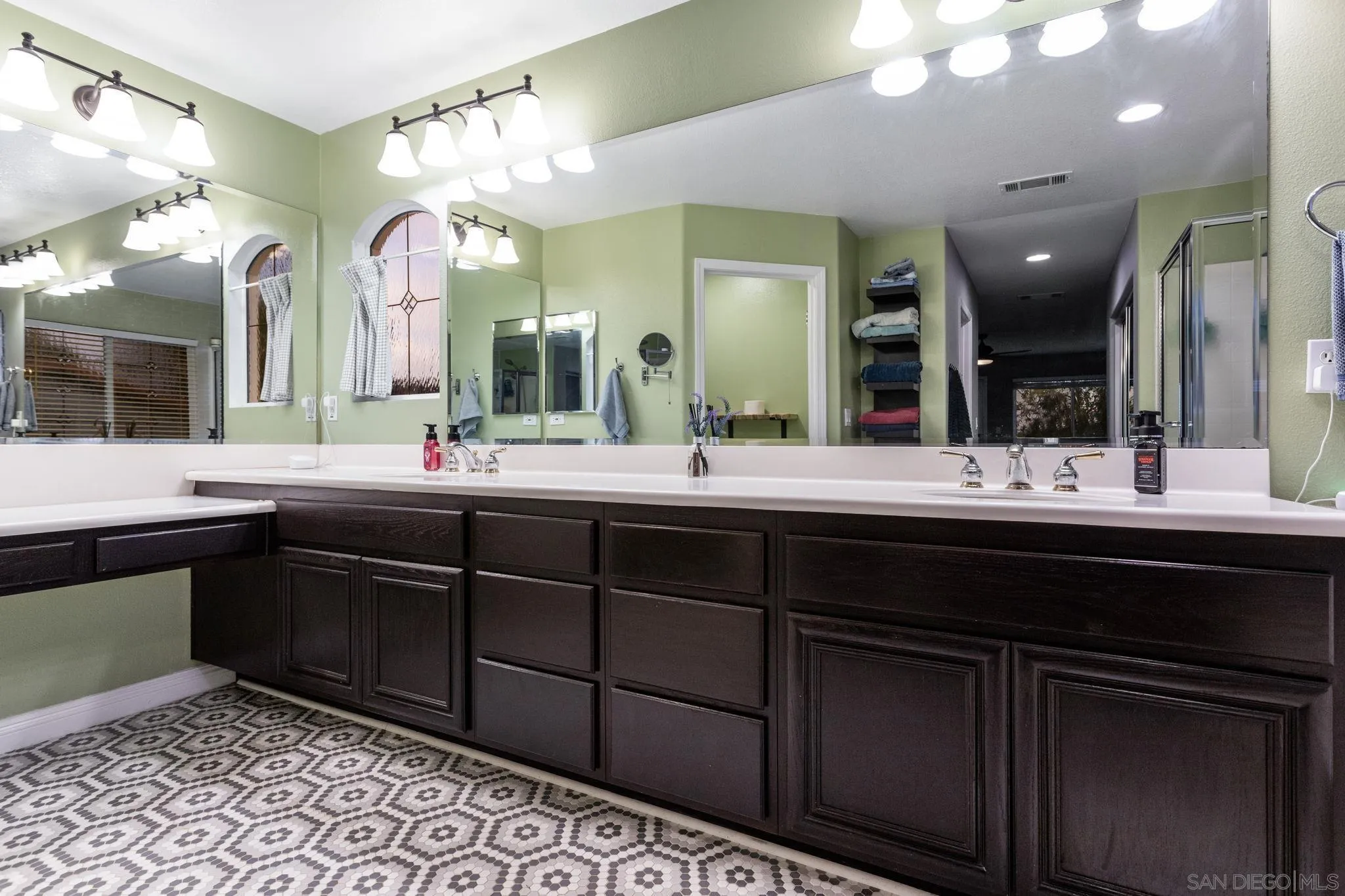 2103 Drew Road Escondido, CA 92027 - Photo 30 of 60 a bathroom with a double vanity sink and a large mirror
