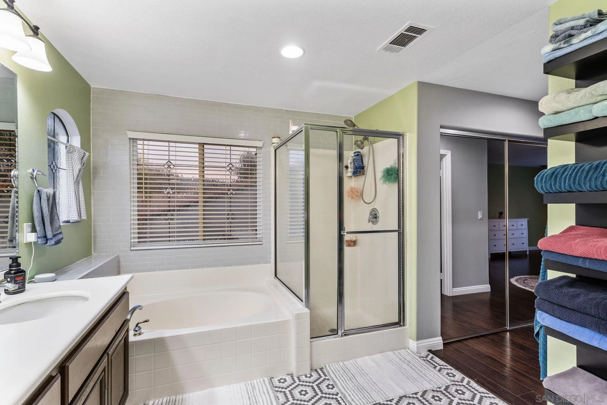 2103 Drew Road Escondido, CA 92027 - Photo 31 of 60 a bathroom with a tub sink and a mirror
